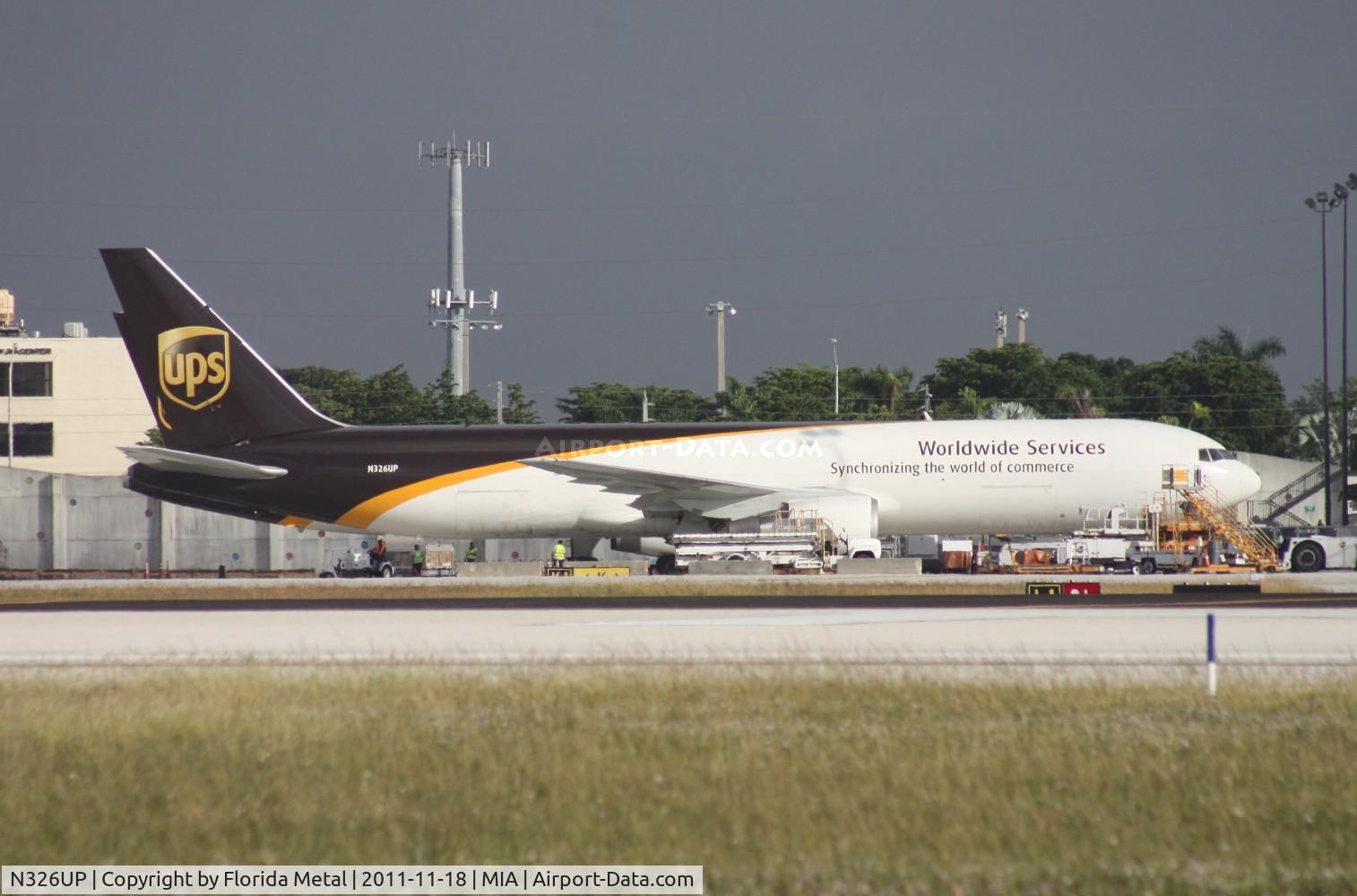 N326UP, 1998 Boeing 767-34AF C/N 27752, UPS 767-300 on ramp across from the photo holes on 25th St.
