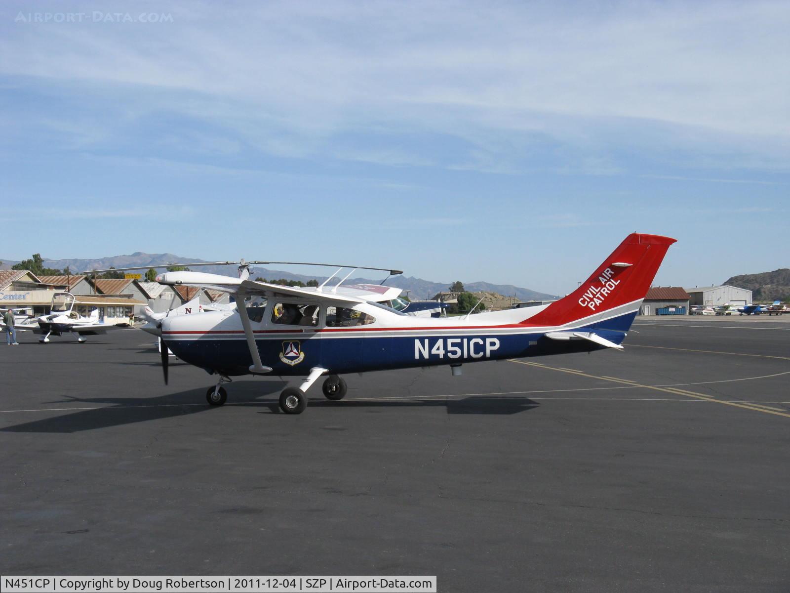 N451CP, Cessna 182T Skylane C/N 18282194, Cessna 182T SKYLANE of CAP, Continental O-470 230 Hp, the juxtaposed/superimposed-appearing rotor is on another aircraft behind, a jump-start Autogyro, taxi