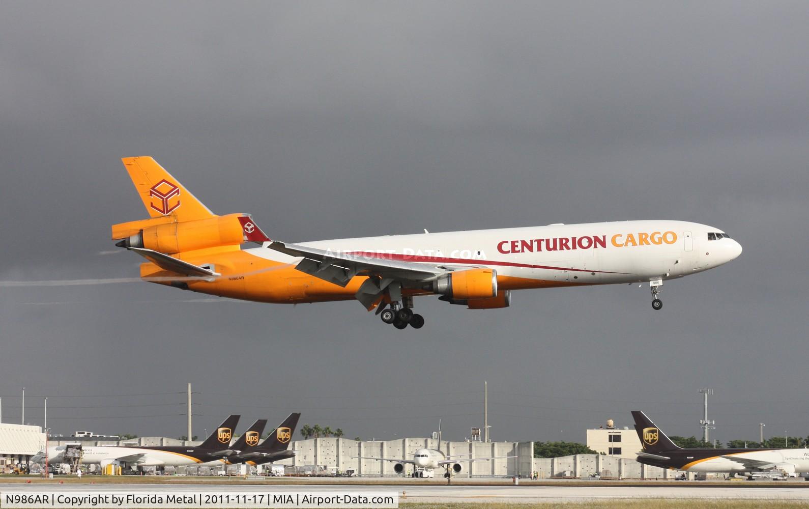 N986AR, 1991 McDonnell Douglas MD-11F C/N 48426, Centurion MD-11F trailing humidity streamers landing on 8L