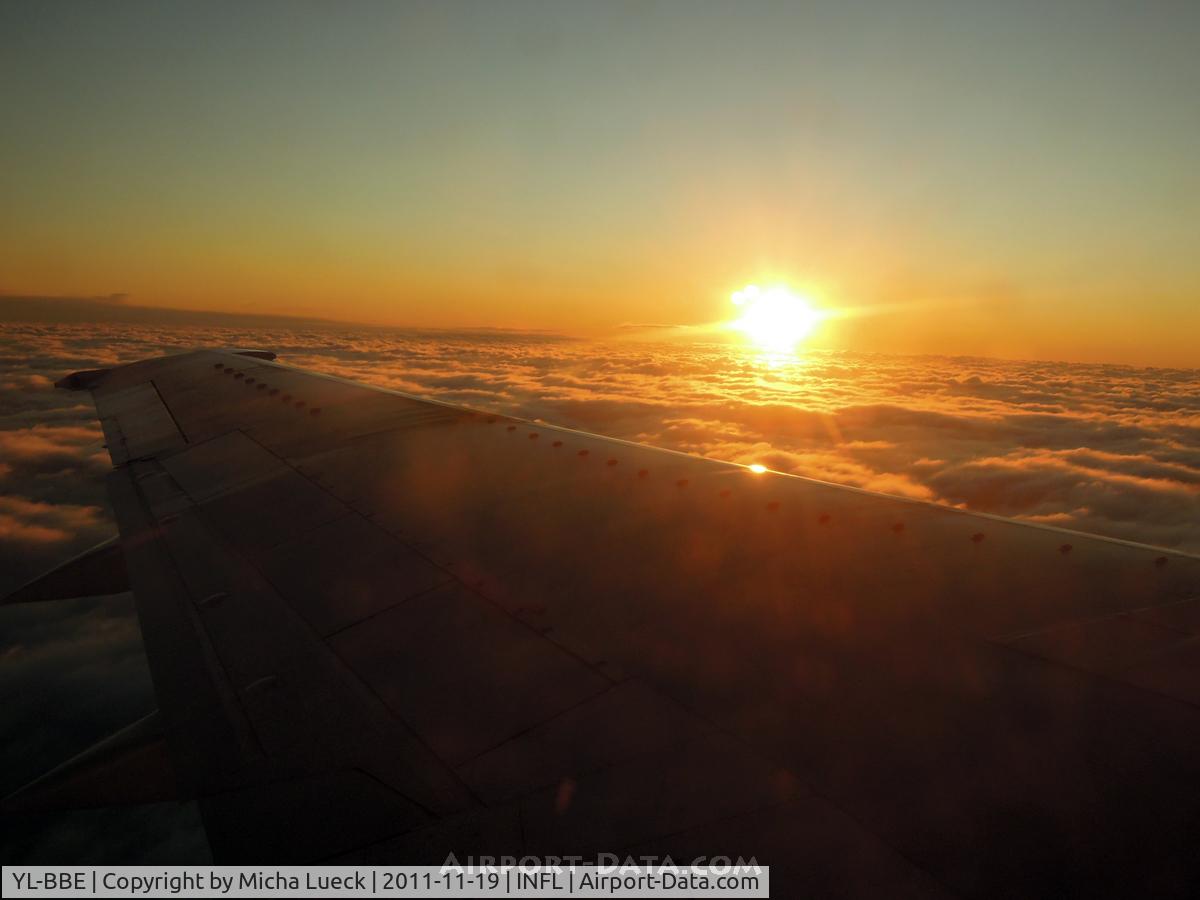 YL-BBE, 1998 Boeing 737-53S C/N 29073, Sunrise over the Baltic Sea, on route from Helsinki to Riga