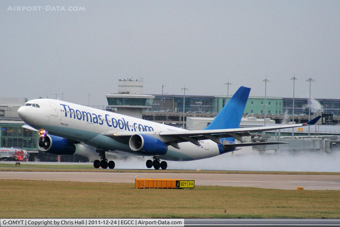 G-OMYT, 1999 Airbus A330-243 C/N 301, missing the Thomas Cook logo on the tail after returning from lease with Garuda Indonesia