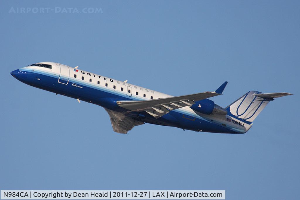 N984CA, 1997 Canadair CRJ-100ER (CL-600-2B19) C/N 7171, United Express (SkyWest Airlines) N984CA (FLT SKW6440) climbing out from RWY 25R en route to Colorado Springs Municipal (KCOS).
