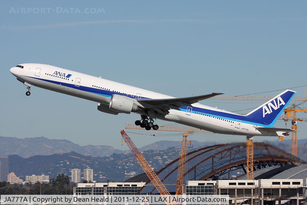 JA777A, 2006 Boeing 777-381/ER C/N 32650, All Nippon Airways JA777A (FLT ANA5) climbing out from RWY 25R en route to Tokyo Narita Int'l (RJAA/NRT).