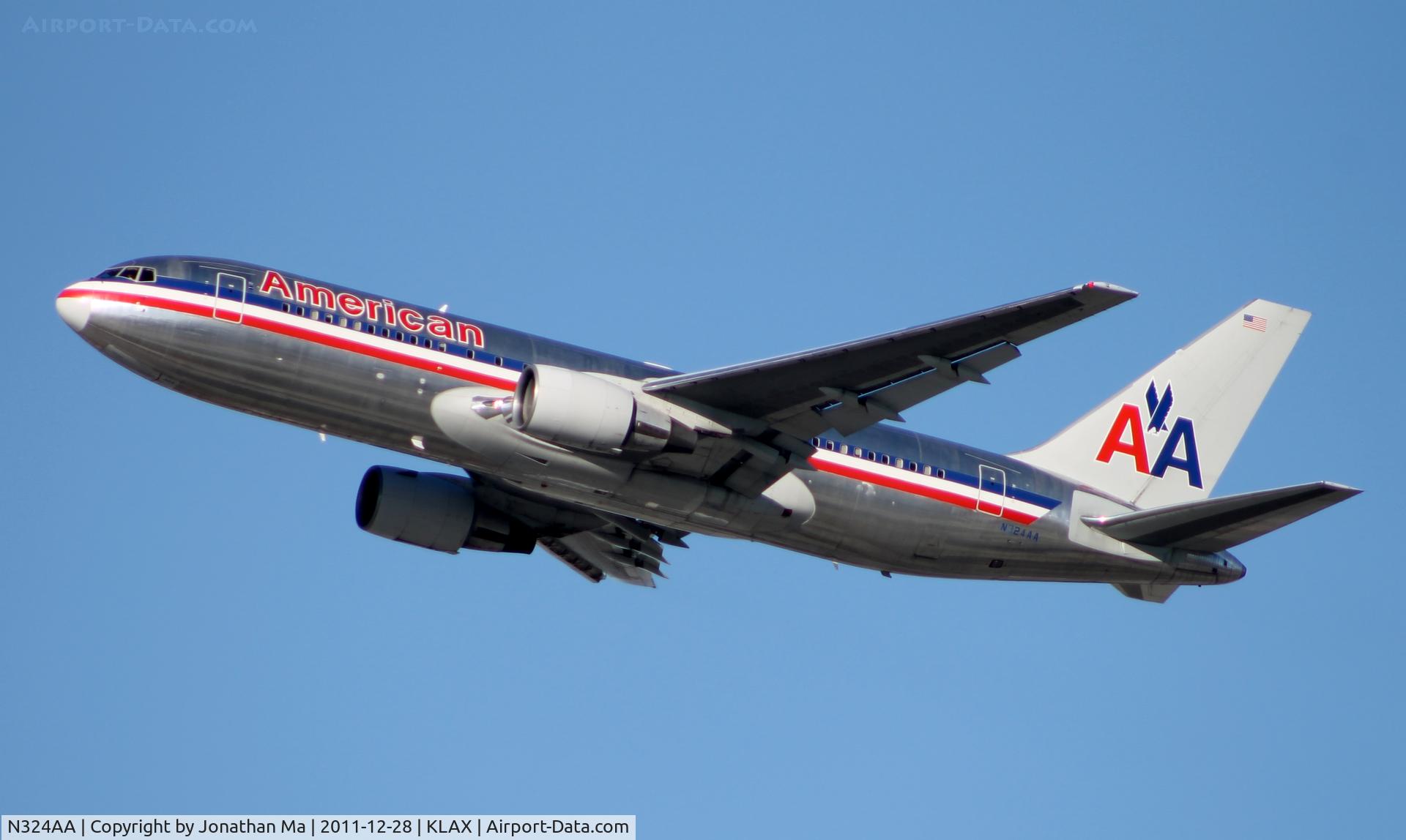 N324AA, 1986 Boeing 767-223 C/N 22325, An AA 762 with a fading registration number takes off from LAX