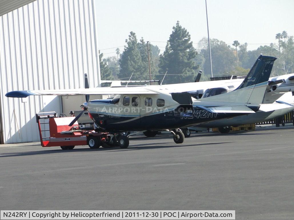 N242RY, 1978 Cessna P210N Pressurised Centurion C/N P21000036, Hooked up to a tug and parked at Howard Aviation