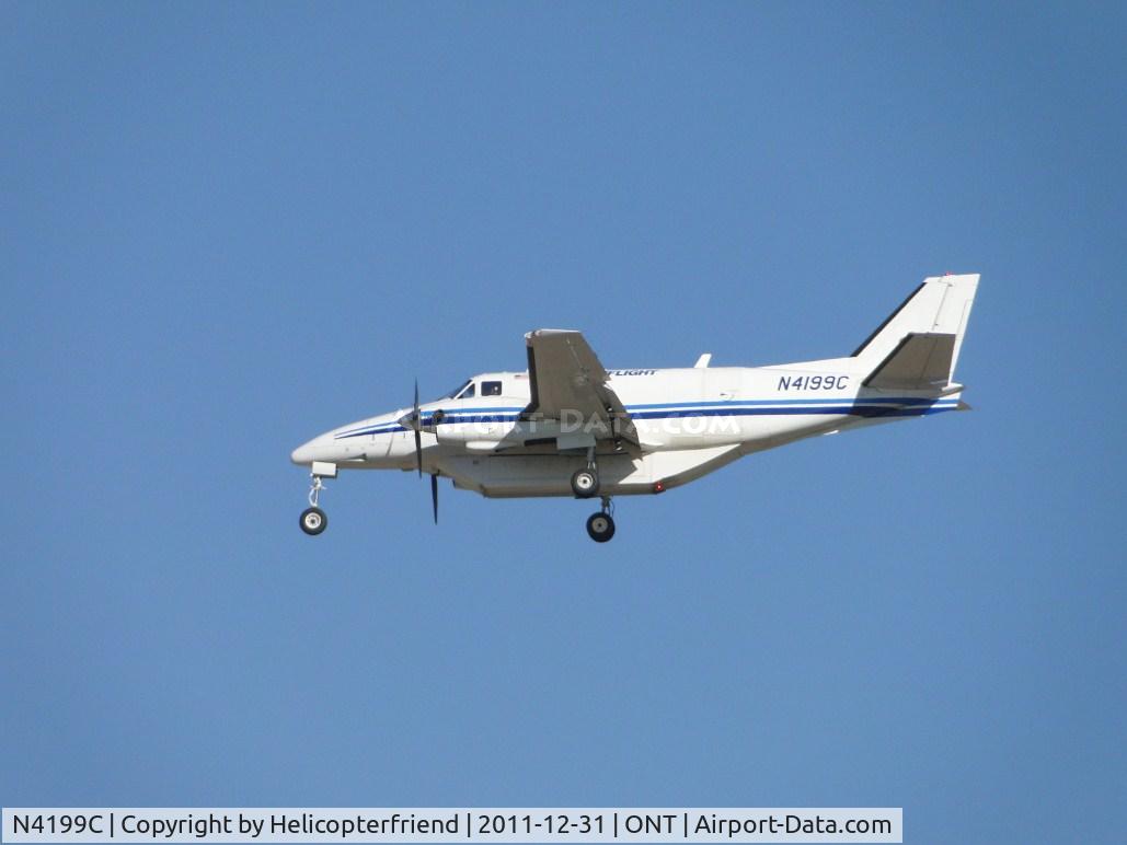N4199C, 1968 Beech 99 C/N U-50, On final to runway 26R, note belly cargo pod