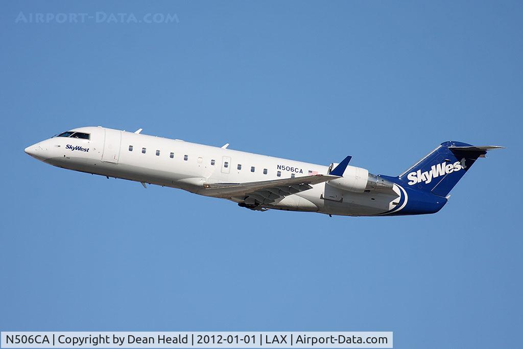 N506CA, 2003 Bombardier CRJ-200ER (CL-600-2B19) C/N 7793, SkyWest Airlines N506CA (FLT SKW5435) climbing out from RWY 25R en route to El Paso Int'l (KELP).