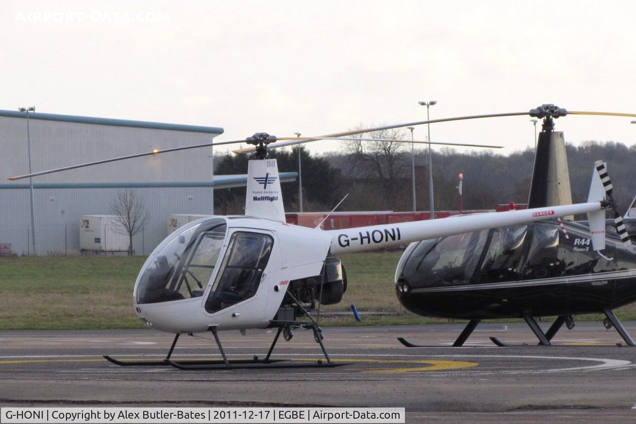 G-HONI, 1988 Robinson R22 Beta C/N 0871, Parked on the apron