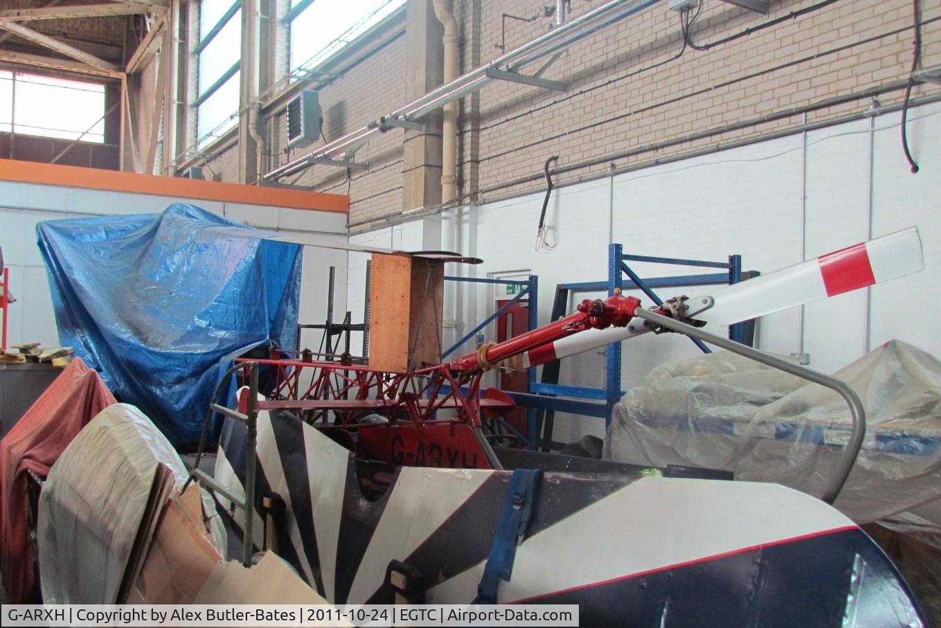 G-ARXH, 1949 Bell 47G C/N 40, Inside the Bonus Aviation Hangar, over 62 years old!! this helicopter has apparently been in the far side of this hangar for over a decade?