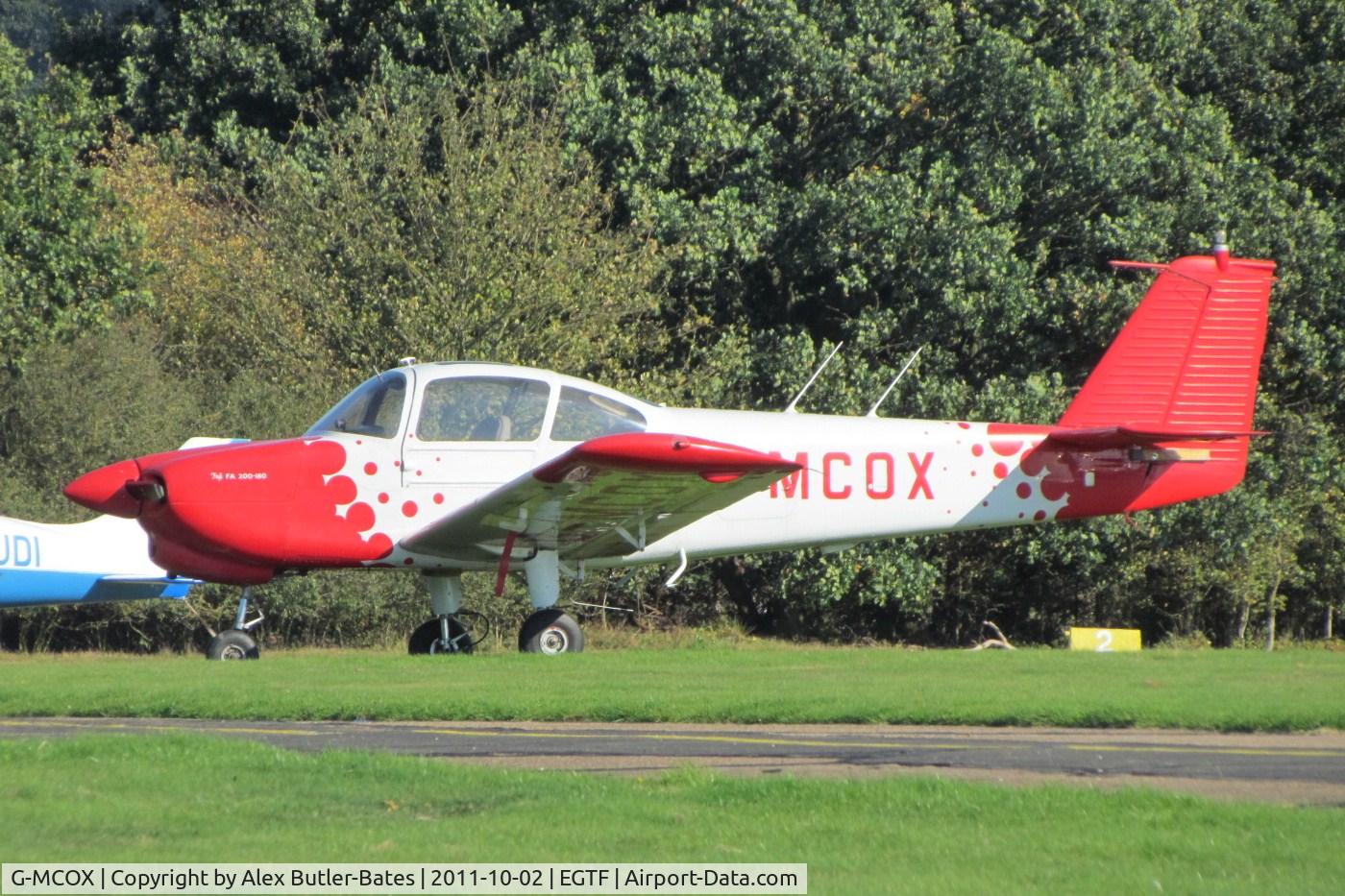 G-MCOX, 1980 Fuji FA-200-180 Aero Subaru C/N 296, Parked on the grass