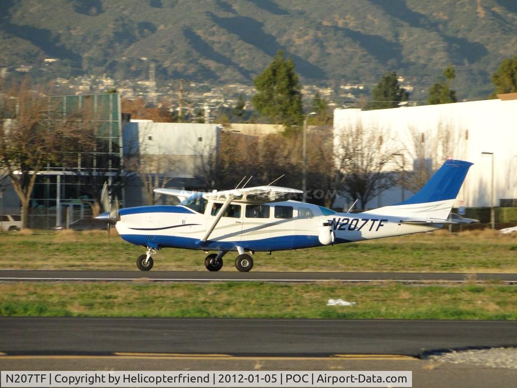N207TF, 1987 Cessna T207A C/N 20700492, Taking off on runway 26L after dropping off passengers at Howard Aviation