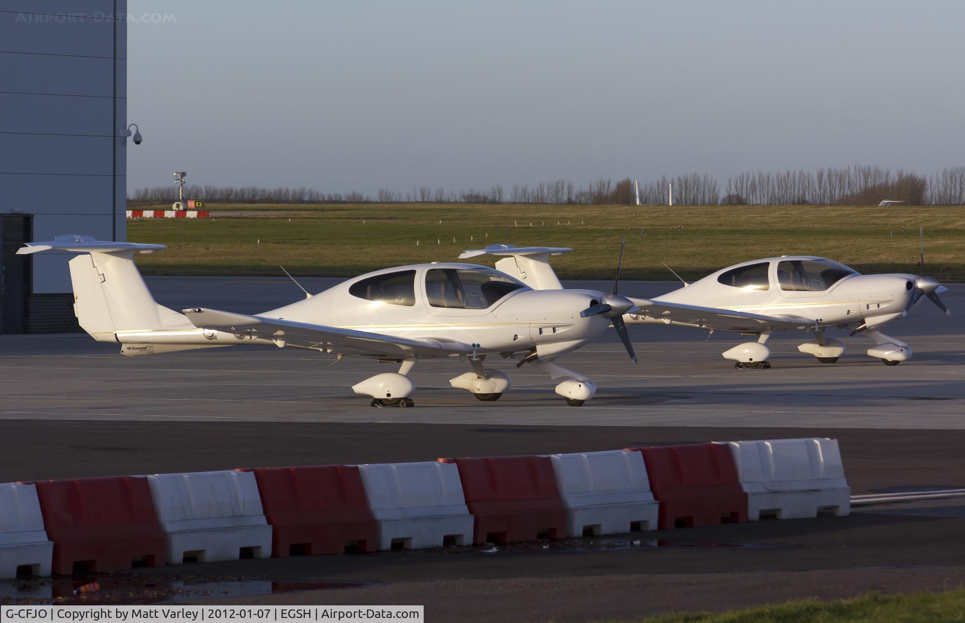 G-CFJO, 2007 Diamond DA-40D Diamond Star C/N D4.296, Pair of DA40's sat on stand at SaxonAir.