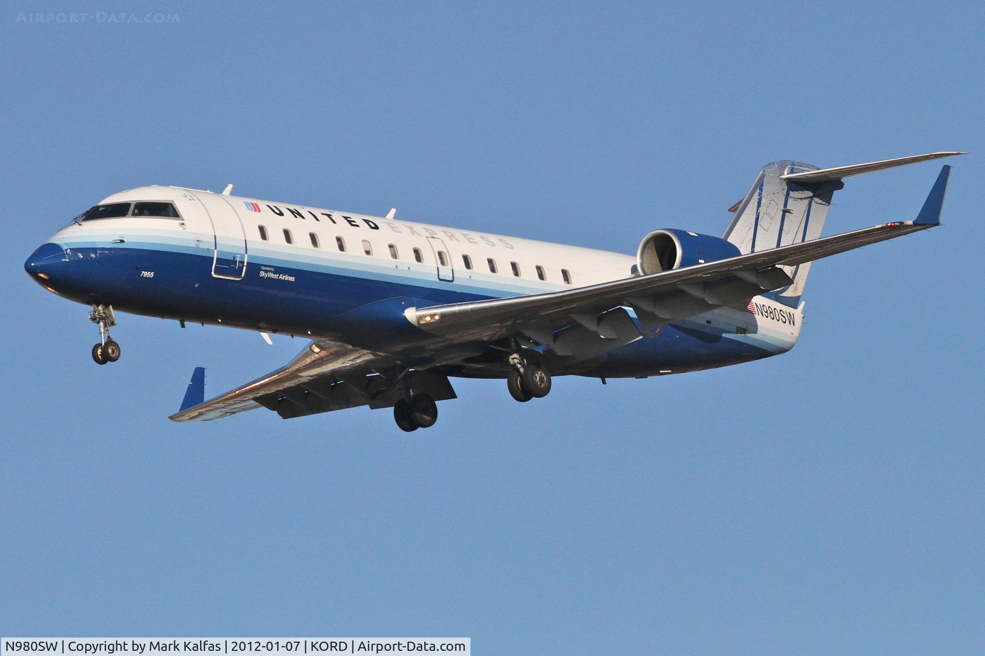 N980SW, 2004 Bombardier CRJ-200ER (CL-600-2B19) C/N 7955, SkyWest/United Express Bombardier CL-600-2B19, SKW6295 arriving from KLIT, RWY 28 approach KORD.