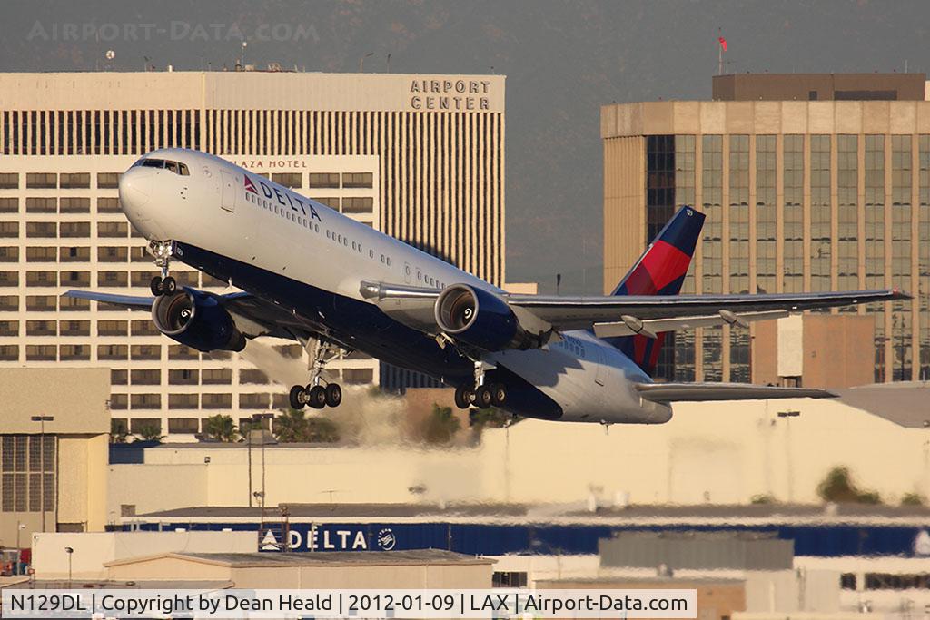 N129DL, 1988 Boeing 767-332 C/N 24079, Delta Air Lines N129DL (FLT DAL2017) departing RWY 25R en route to Las Vegas McCarran Int'l (KLAS).  One of two special flights today to Las Vegas for the 2012 Consumer Electronics Show, which runs Jan 10-13, 2012.
