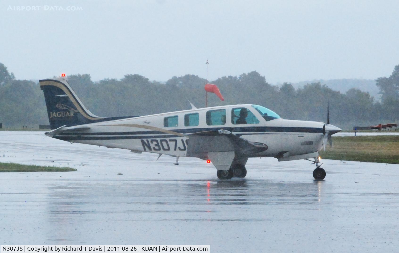 N307JS, 1999 Raytheon Aircraft Company A36 Bonanza C/N E-3268, 1999 Raytheon A36 at Danville Regional on a very rainy afternoon.