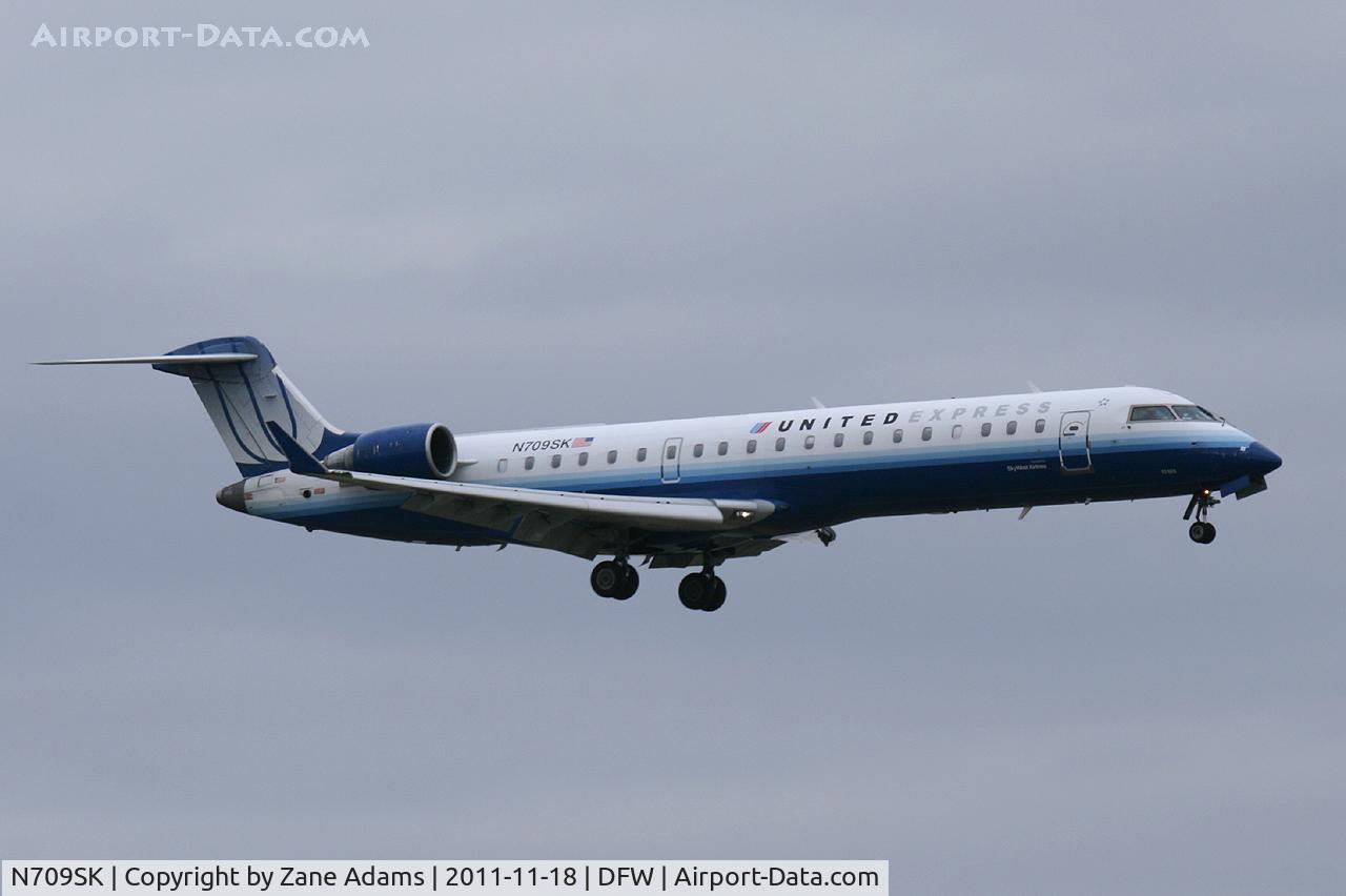 N709SK, 2004 Bombardier CRJ-701ER (CL-600-2C10) Regional Jet C/N 10159, United Express at DFW Airport