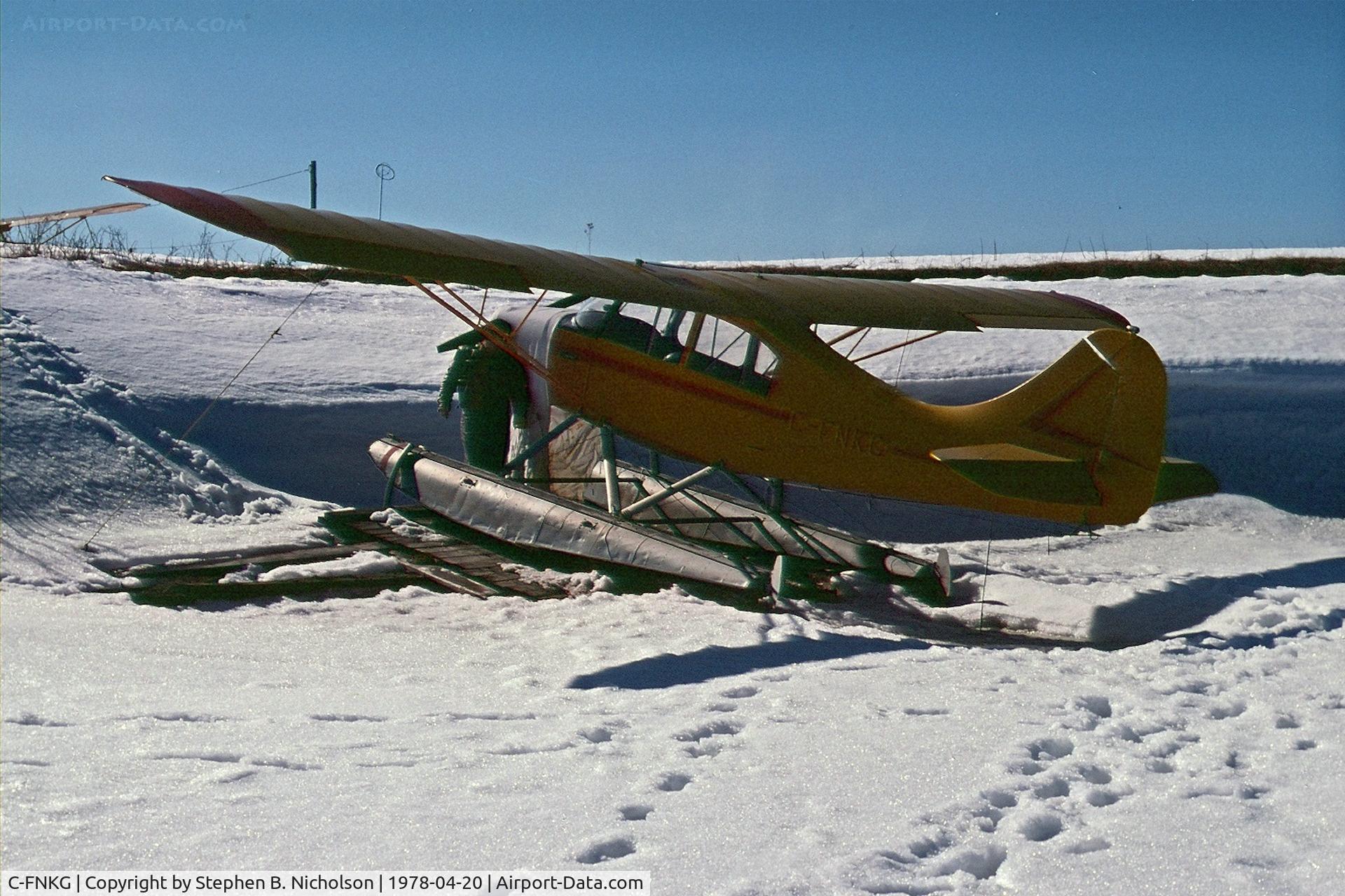 C-FNKG, 1955 Champion 7EC C/N 7EC 305, Seen in Dryden, Ontario pulled up on the shore of Wabigoon Lake on April 20, 1978. The photographer and Paul Boles were investigating its possible purchase for the Sioux Lookout Flying Club.