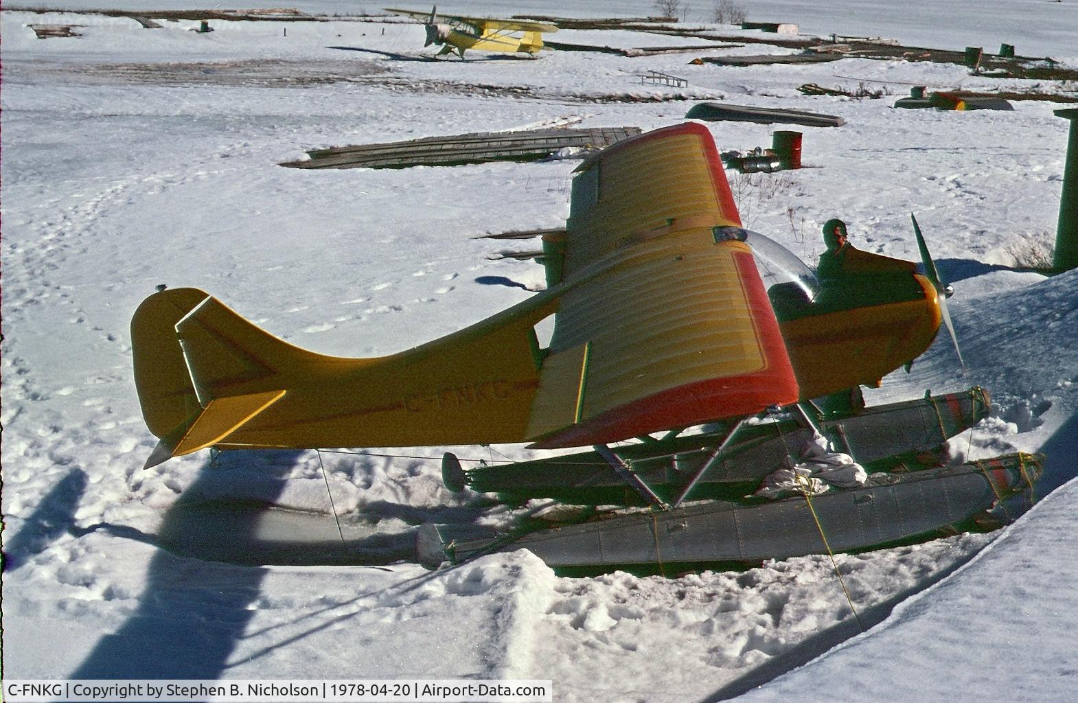 C-FNKG, 1955 Champion 7EC C/N 7EC 305, Seen in Dryden, Ontario pulled up on the shore of Wabigoon Lake on April 20, 1978. The photographer and Paul Boles were investigating its possible purchase for the Sioux Lookout Flying Club.