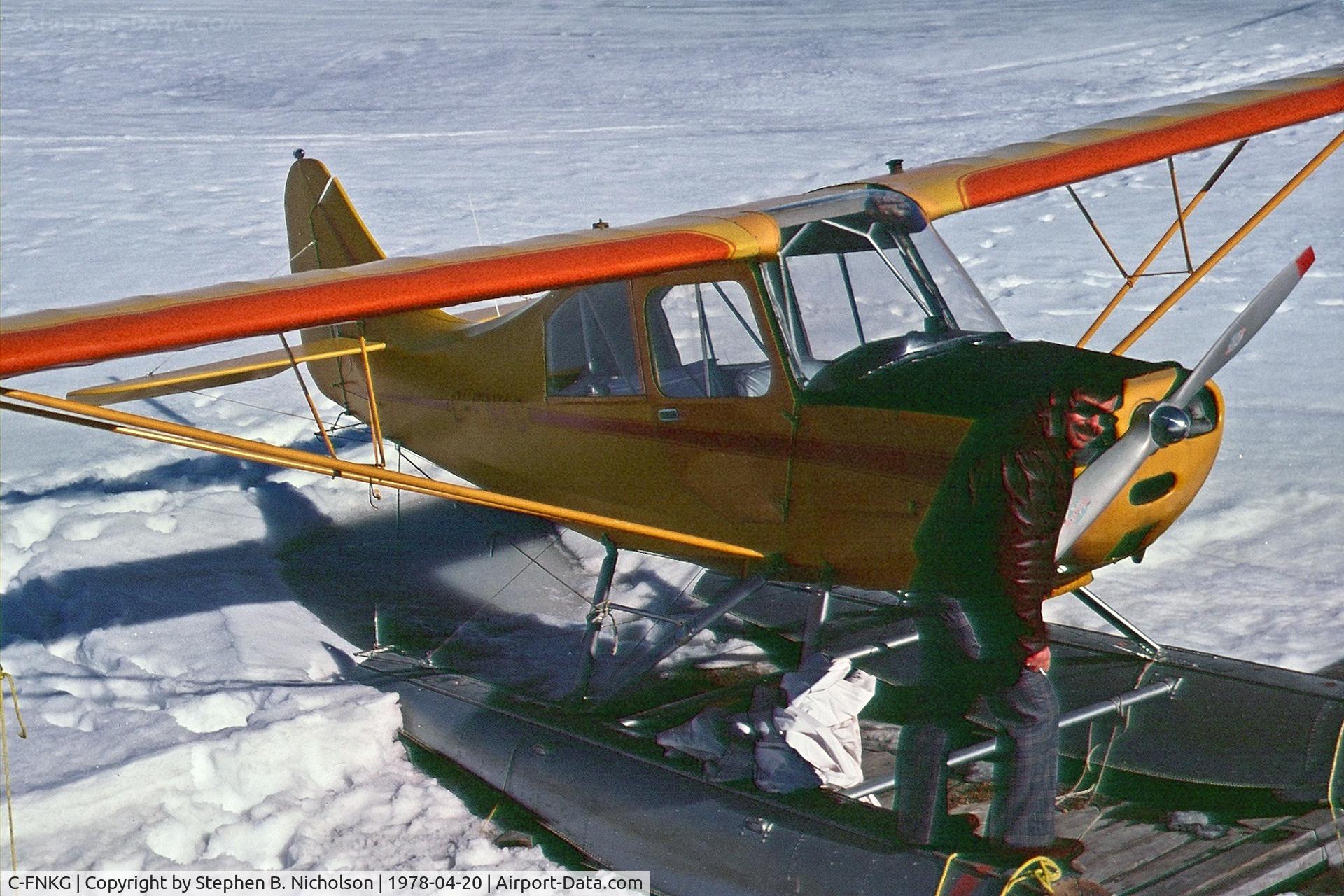 C-FNKG, 1955 Champion 7EC C/N 7EC 305, Seen in Dryden, Ontario pulled up on the shore of Wabigoon Lake on April 20, 1978. The photographer and Paul Boles were investigating its possible purchase for the Sioux Lookout Flying Club.