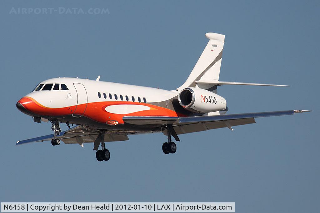 N6458, 2004 Dassault Falcon 2000EX C/N 26, Nike Inc 2004 Dassault Falcon 2000EX N6458 from Lakefront Airport (KNEW) - New Orleans, LA on short final to RWY 25L. Tail number of this aircraft was recently changed from N6453 to N6458.