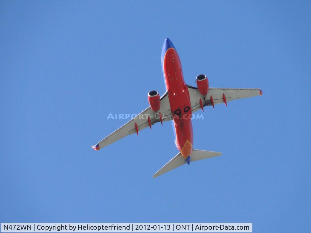 N472WN, 2004 Boeing 737-7H4 C/N 33831, Just took off from runway 8L and is turning southbound