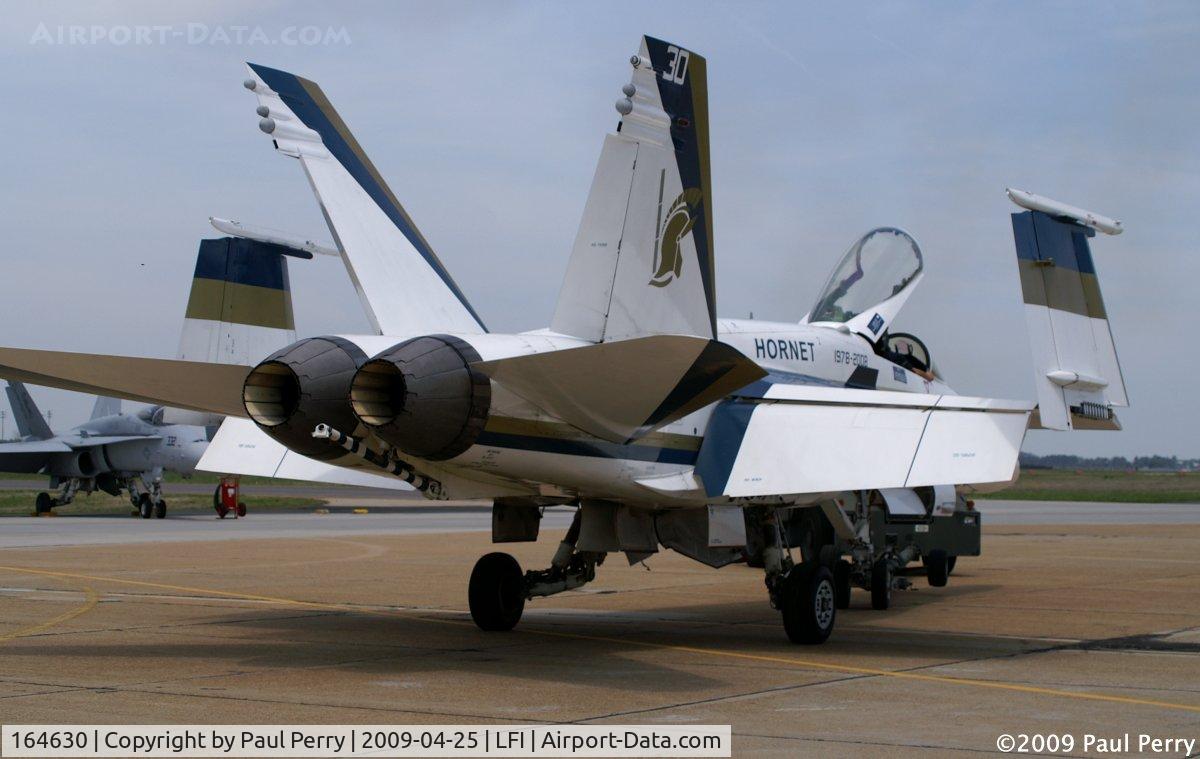 164630, 1991 McDonnell Douglas F/A-18C Hornet C/N 1047/C259, Getting towed back to her spot on the ramp.