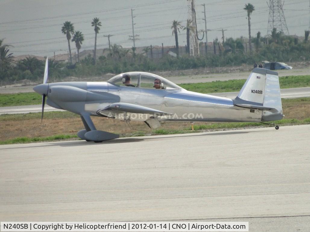 N240SB, 2000 Vans RV-4 C/N 01, Rear seater observing photographers as plane taxi's back to hanger