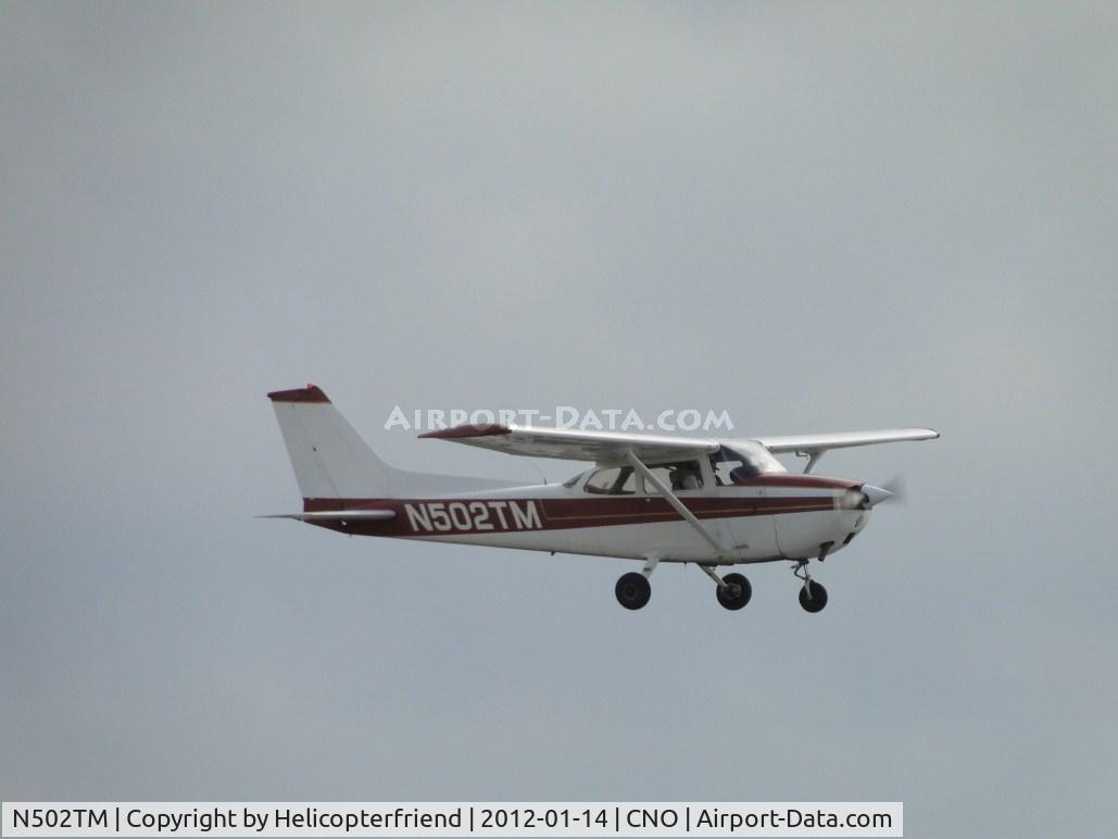 N502TM, 1975 Cessna 172M C/N 17265893, Flying by over runway 26R