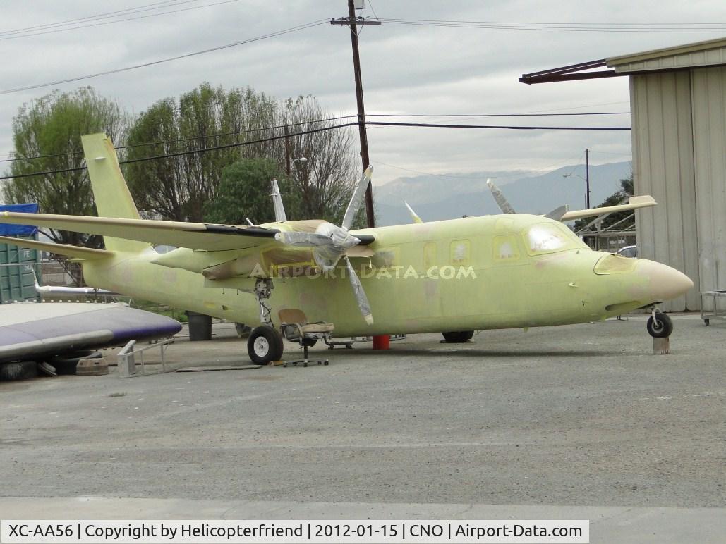 XC-AA56, Gulfstream American 695C Jetprop 1000 C/N 11695, In the paintshop area with a primer coat on her and parts taped up, waiting for paint