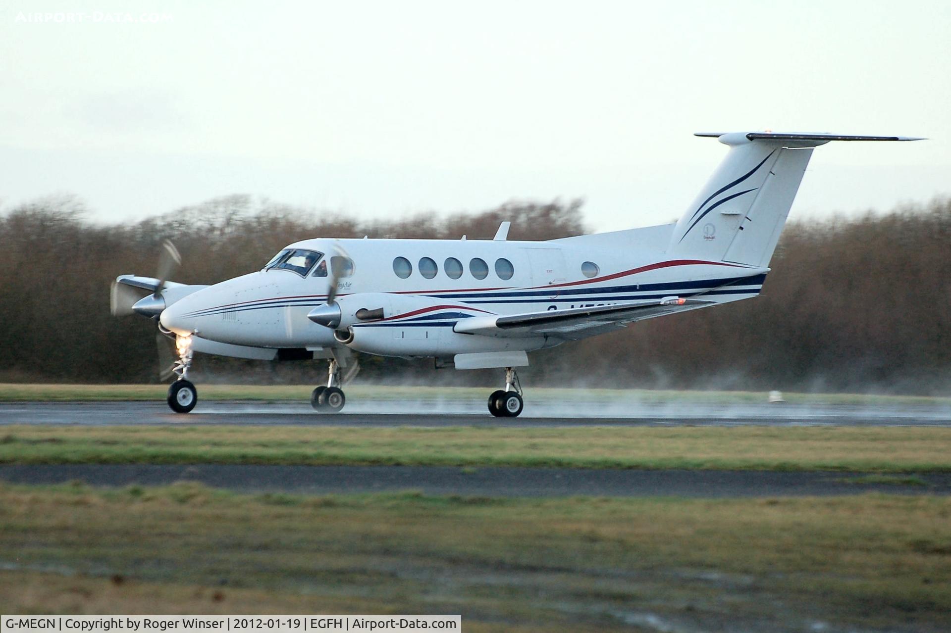 G-MEGN, 1995 Beech B200 Super King Air King Air C/N BB-1518, Super King Air of Cardiff based Dragonfly Aviation Services departing on a wet Runway 22.