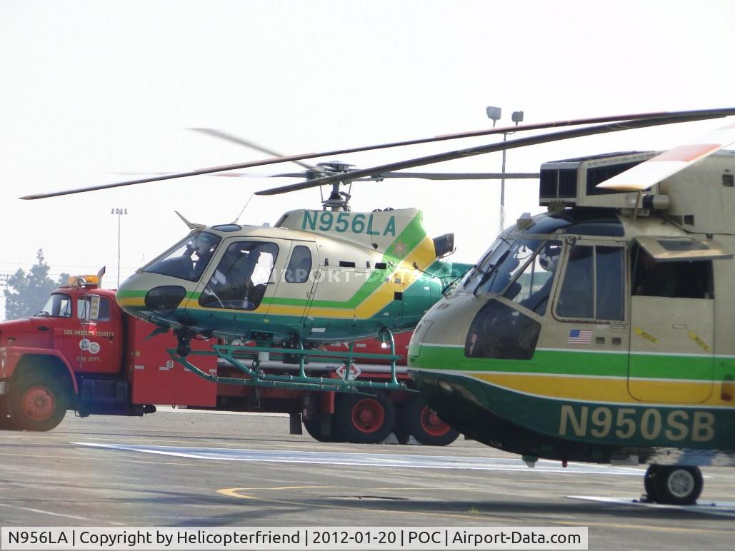 N956LA, 2010 Eurocopter AS-350B-2 Ecureuil Ecureuil C/N 7047, Passing LA Co Rescue 5 (N950SB) air taxiing to taxiway Sierra for take off