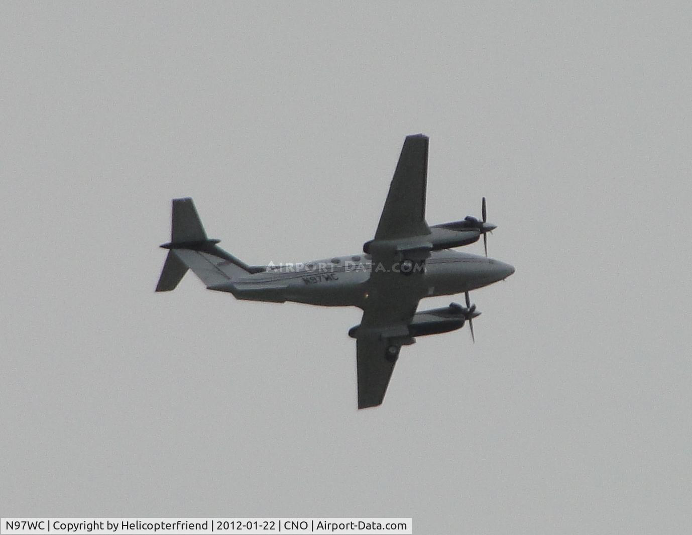 N97WC, 1990 Beech B200 King Air C/N BB-1382, Landing gear deployed fly over runway 26R