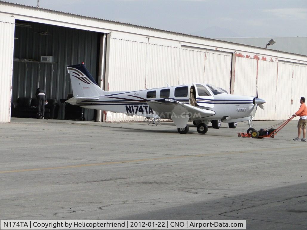 N174TA, Raytheon Aircraft Company A36 Bonanza C/N E-3499, Using a small tug to push the ship into the hanger