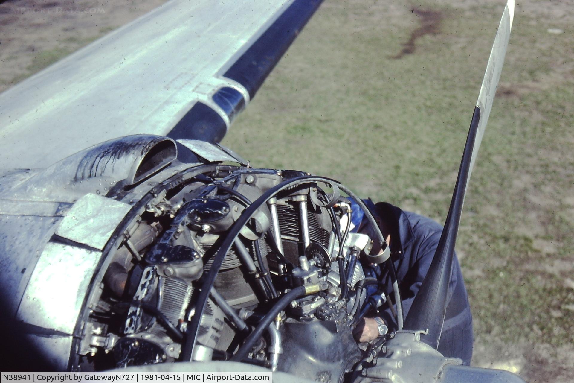N38941, Douglas DC-3-G202A C/N 6332, View from the Captain's seat of engine maintenance in progress.