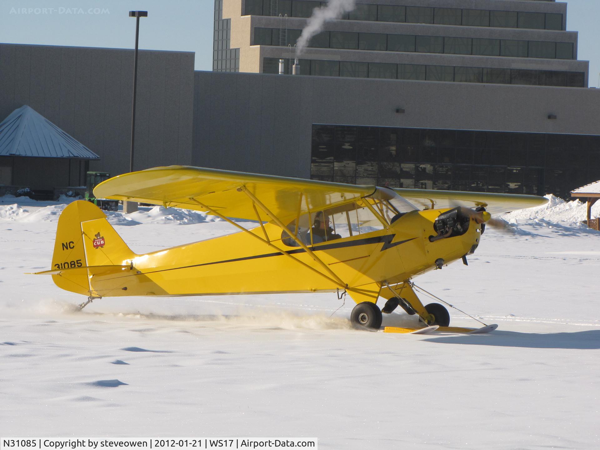 N31085, 1940 Piper J3L C/N 5311, Taxing into Pioneer airport on ski's