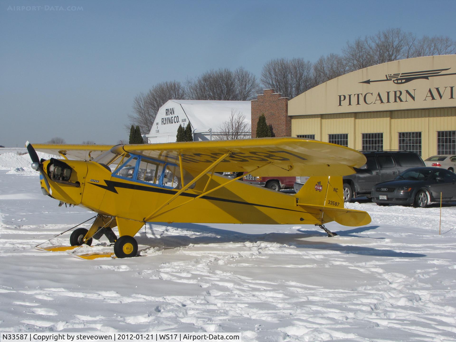 N33587, 1945 Piper J3C-65 Cub Cub C/N 14064, fresh snow equals ski's