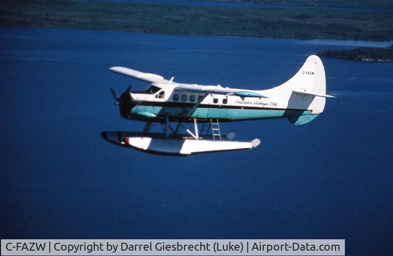 C-FAZW, 1966 De Havilland Canada DHC-3 Otter Otter C/N 451, AZW over Wollaston Lake, SK, in the early 1980 aprox. (poor slide scan!)