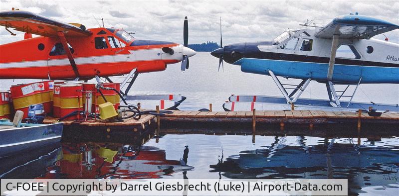 C-FOEE, 1965 De Havilland Canada DHC-2 Turbo Beaver Mk.3 C/N 1598TB10, C-FOEE at the Hatchet Lake, SK, dock with sister DHC-2 MKlll, C-FOEF (no longer existing under this ident)........aprox late 80's.......