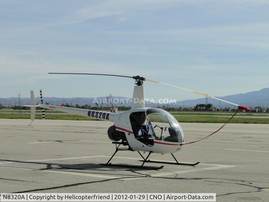 N8320A, 1995 Robinson R22 Beta C/N 2510, Parked and rotor tied down, south and east of the tower