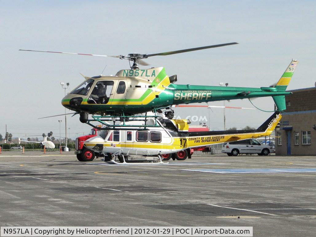 N957LA, 2010 Eurocopter AS-350B-2 Ecureuil Ecureuil C/N 7072, Air Taxiing to taxiway Sierra after dropping off passenger and appears to be hovering over Copter 17
