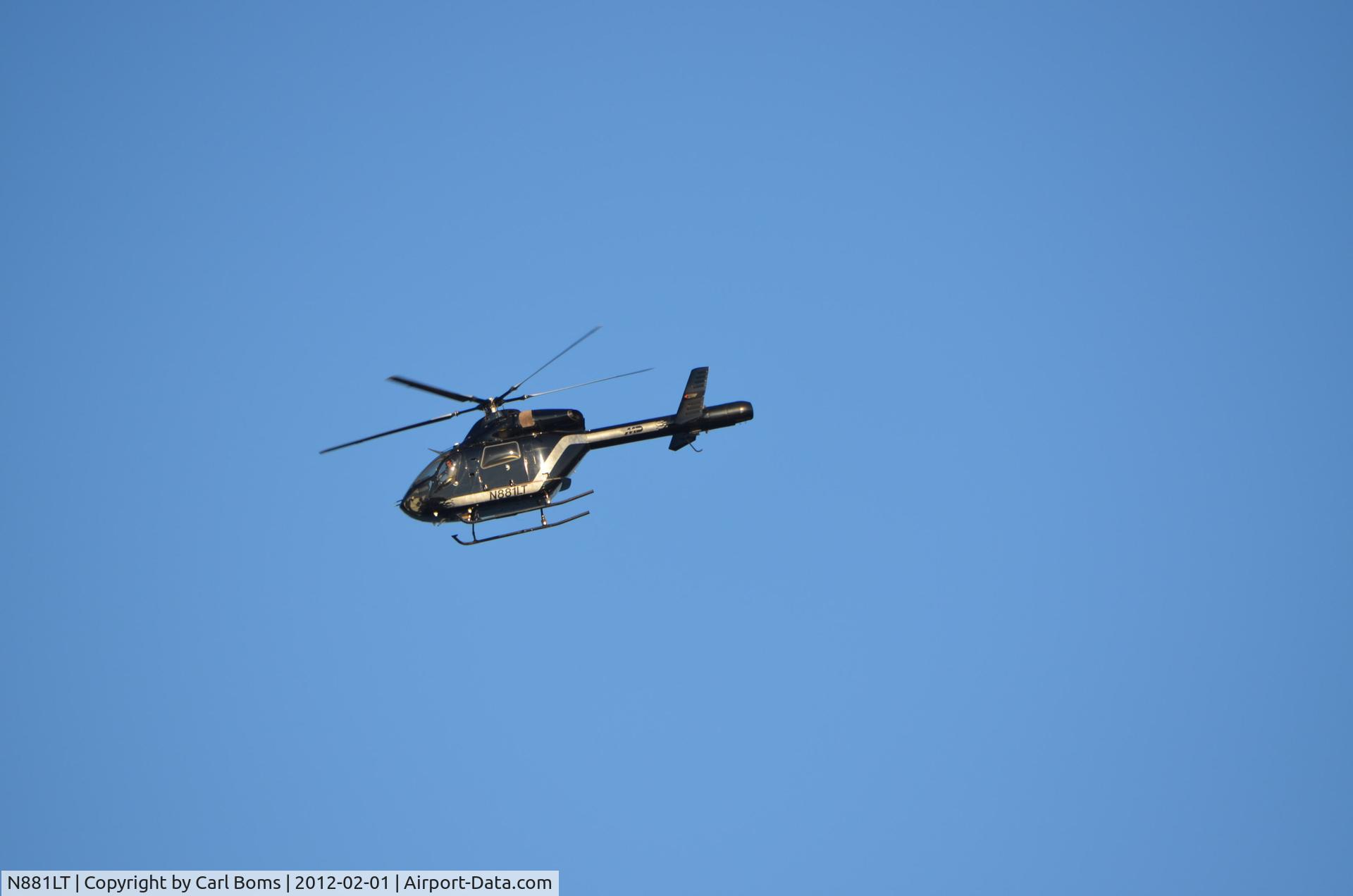 N881LT, 2006 MD Helicopters MD-900 Explorer C/N 900-00117, Taken on warm sunny day (Feb 2, 2012) while watching wind surfers at Sandy Hook (Gateway National Park), New Jersey.
