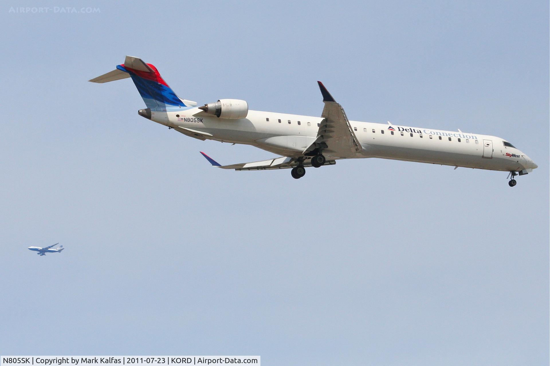 N805SK, 2006 Bombardier CRJ-900ER (CL-600-2D24) C/N 15069, SkyWest/Delta Connection CRJ-900, N805SK RWY 10 approach KORD with a UAL 747 on downwind.