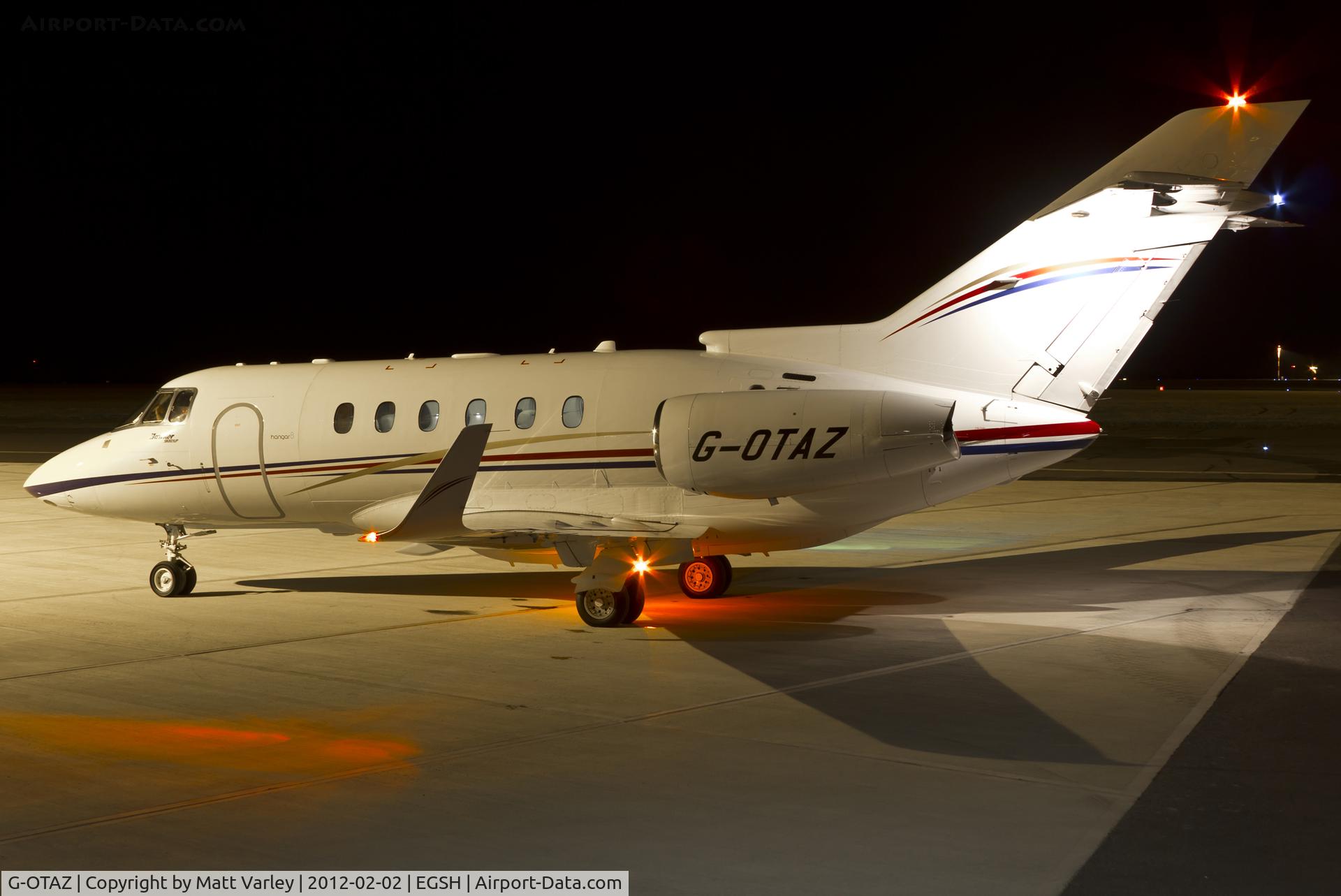 G-OTAZ, 2009 Hawker Beechcraft 900XP C/N HA-0112, Sat on stand, under the floodlights at SaxonAir, awaiting clearance.