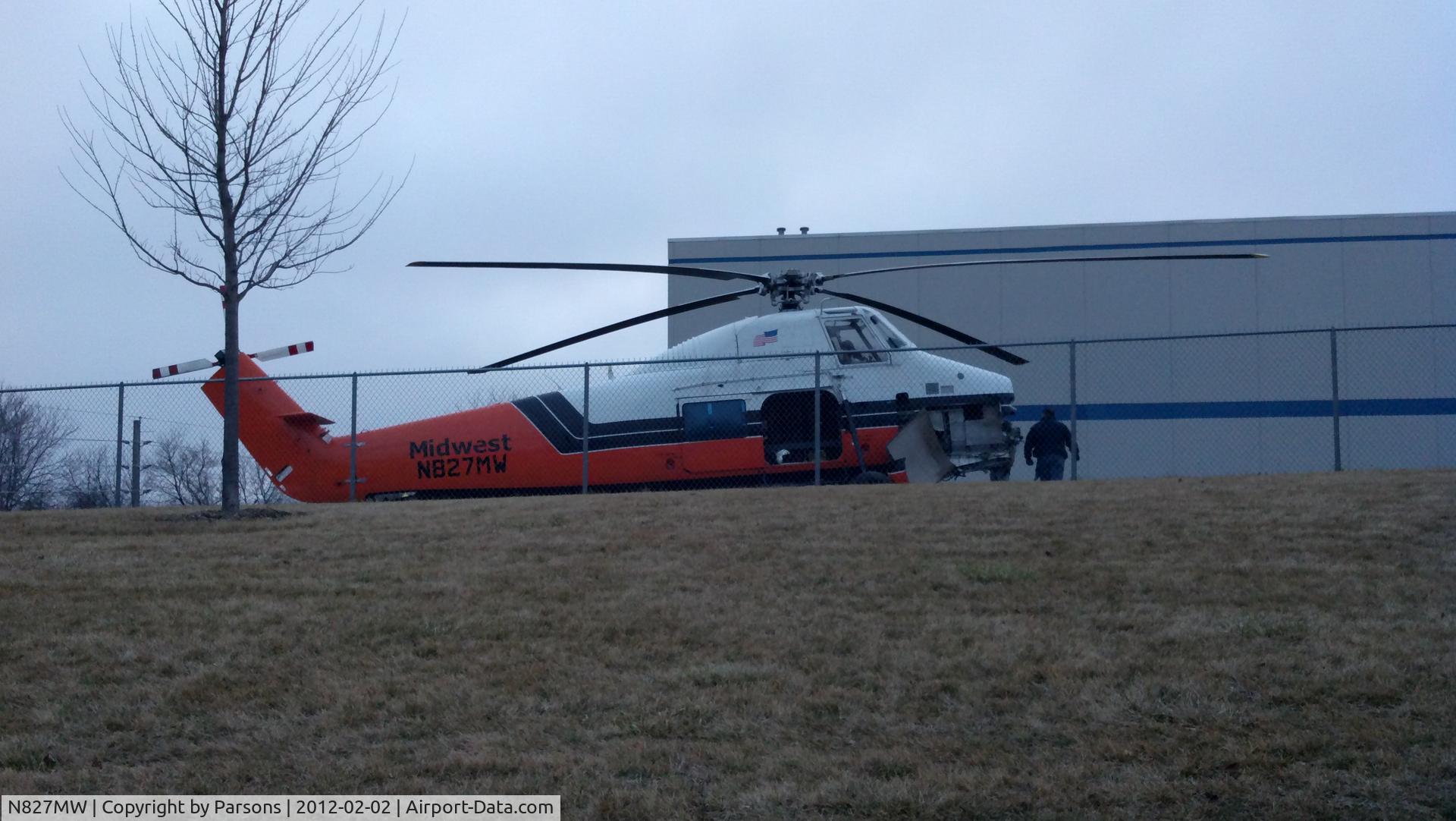 N827MW, 1958 Sikorsky S-58JT C/N 58-827, helicopter putting cooling units on a commercial building