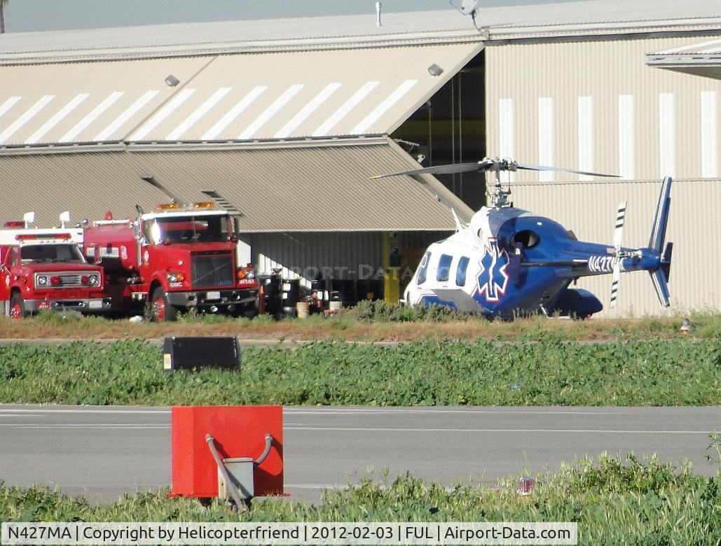 N427MA, 1987 Bell 222UT C/N 47558, Parked on the northside near the Fire Department