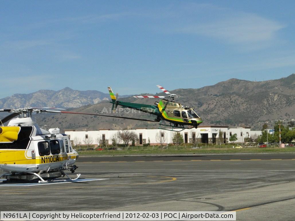 N961LA, 2011 Eurocopter AS-350B-2 Ecureuil Ecureuil C/N 7129, After air taxiing to the west N957LA & N950SB, pilot dropping the nose to pick up air speed for departure eastbound