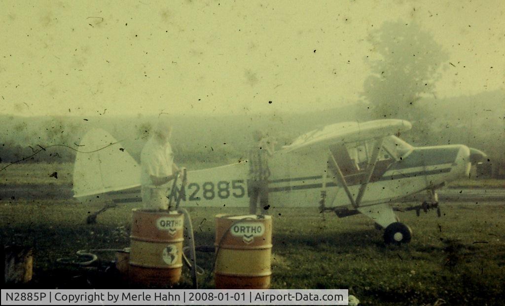 N2885P, 1954 Piper PA-18A 150 Super Cub C/N 18-4482, Bud Confer loading chemicals into N2885P in New Paltz NY in 1969