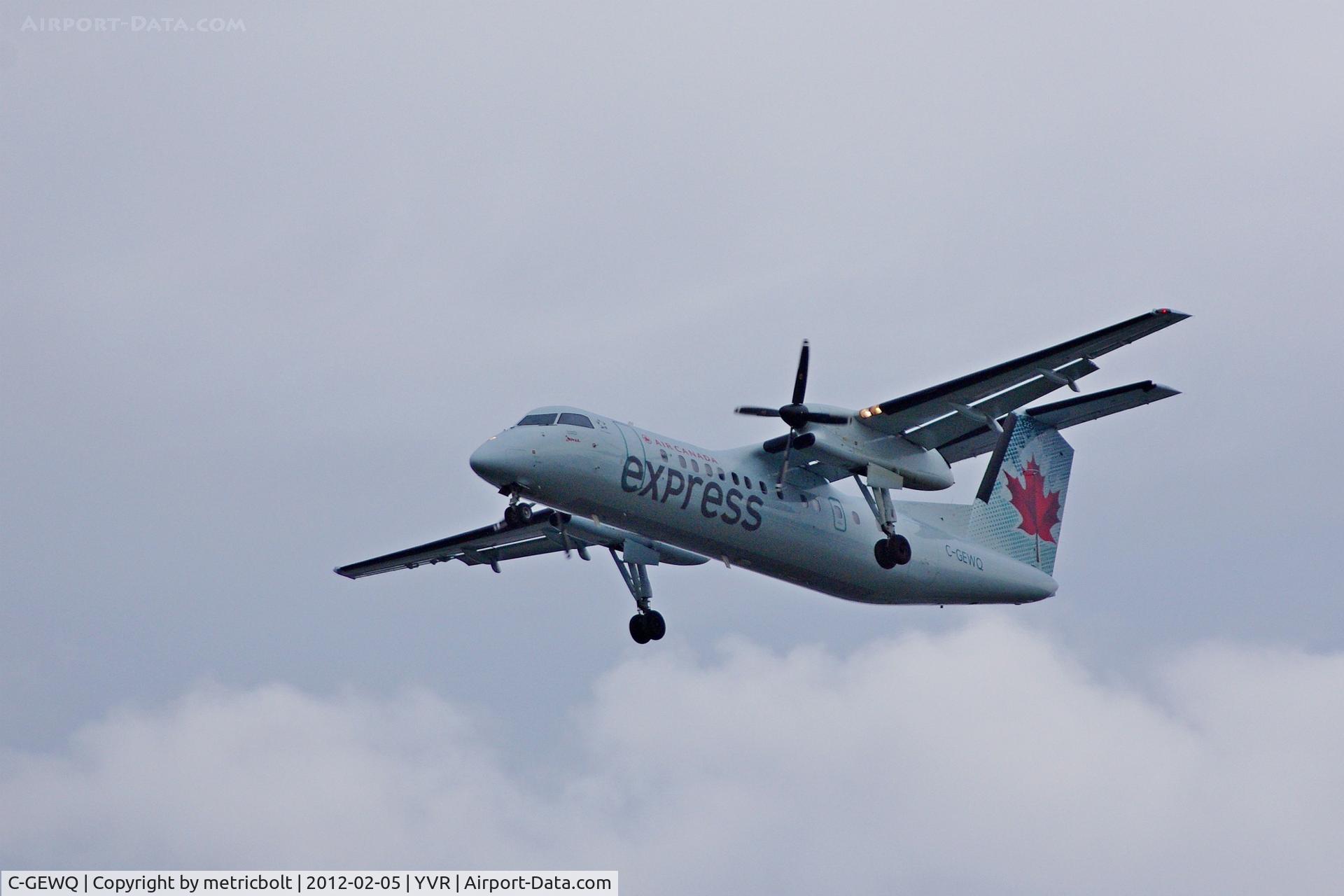 C-GEWQ, 1990 De Havilland Canada DHC-8-311 Dash 8 C/N 202, Landing on a dreary Feb. day Now operating as Air Canada Express.