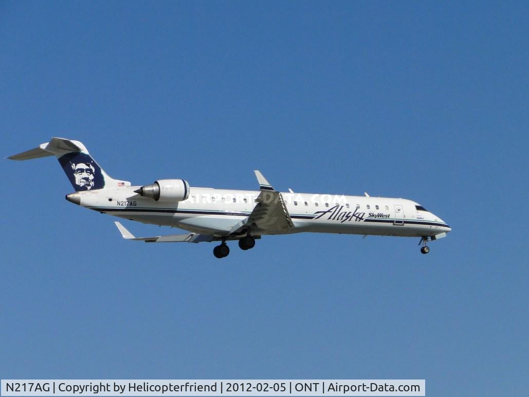 N217AG, 2001 Bombardier CRJ-701 (CL-600-2C10) Regional Jet C/N 10031, On final to runway 8L, just passed the outer fence