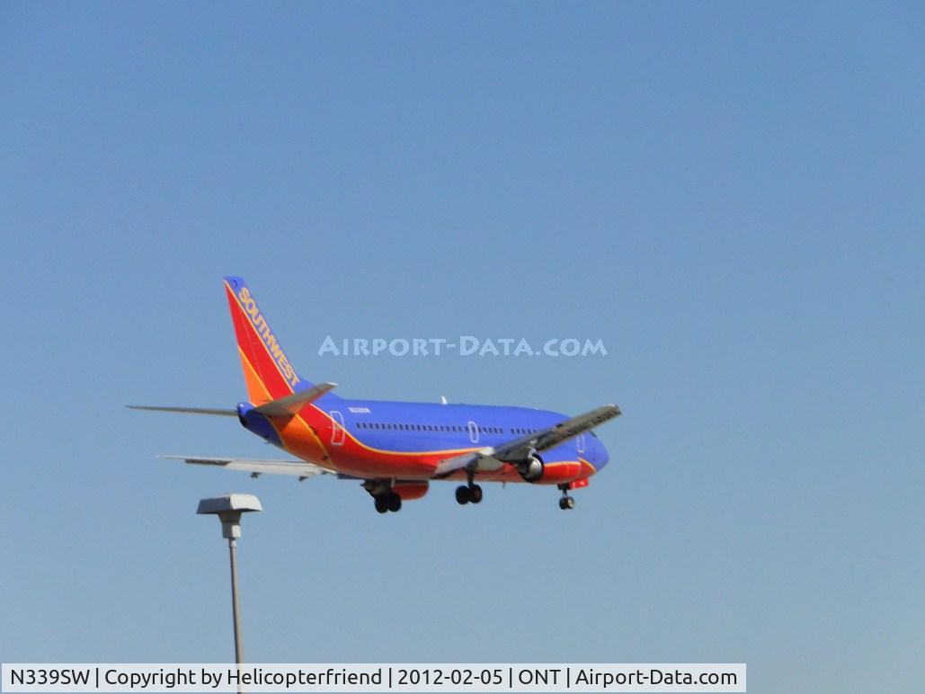 N339SW, 1988 Boeing 737-3H4 C/N 24090, Southwest flt 111 arriving from Oakland, Ca on final to runway 8L, just passing the outer fence.